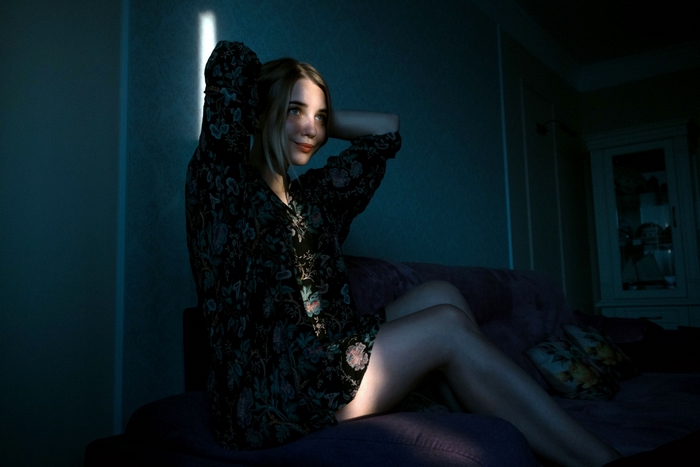 Miroslava Supronenko sitting on a sofa