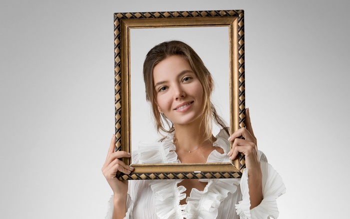 Woman holding a picture frame