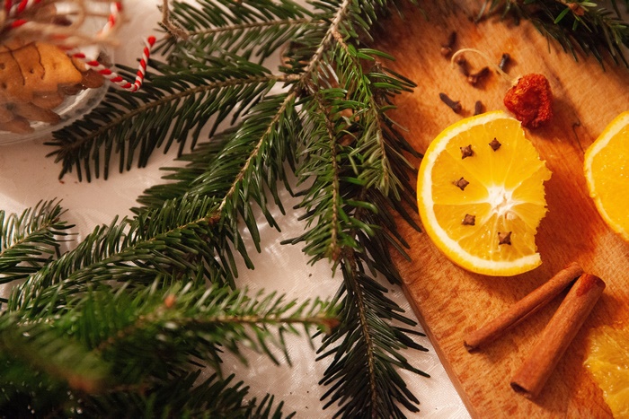 Christmas decoration with orange, cinnamon, and pine