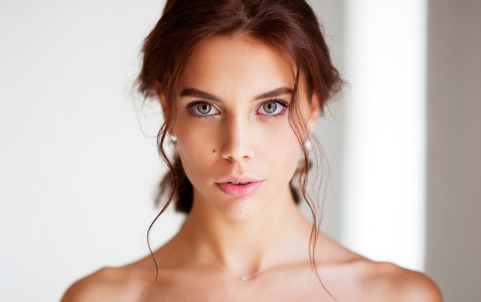Brunette woman with light eyes in a portrait