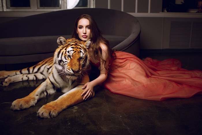 Woman in red dress with tiger