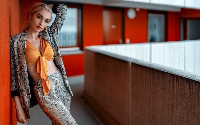 Blonde Woman in Snake Print Outfit Posing