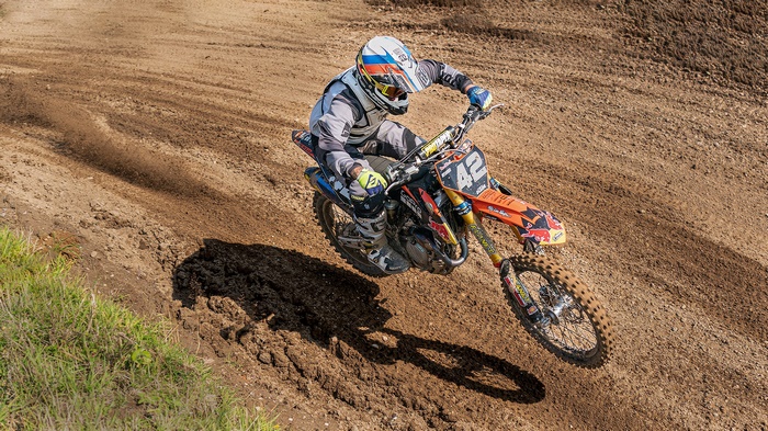 Motocross rider #42 on a dirt track