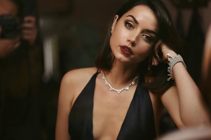 Ana de Armas wearing a black dress and jewelry