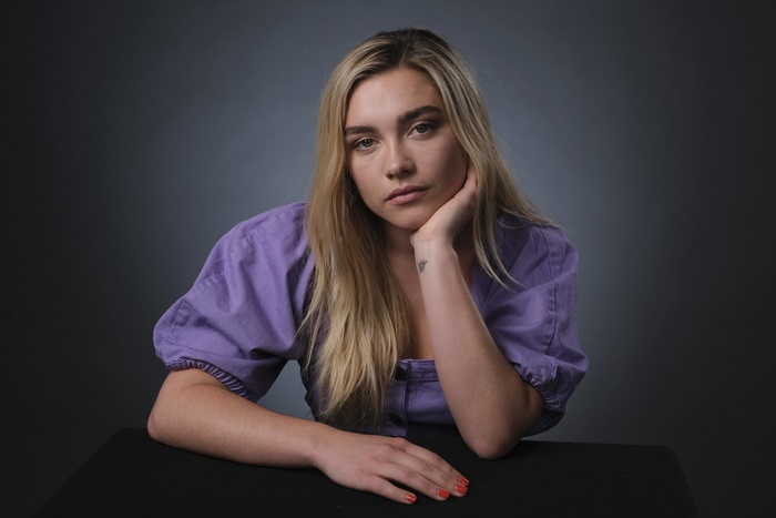Florence Pugh with blonde hair and tattoo