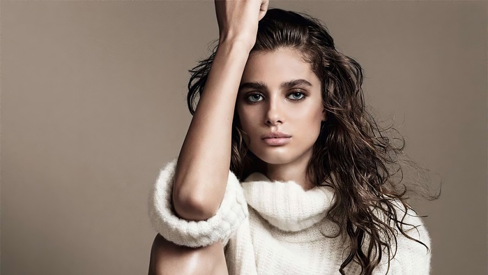 Taylor Marie Hill wearing a white sweater