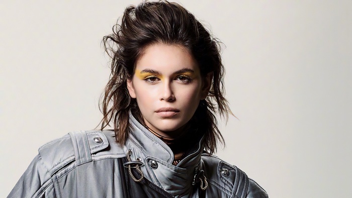 Kaia Gerber wearing a silver jacket