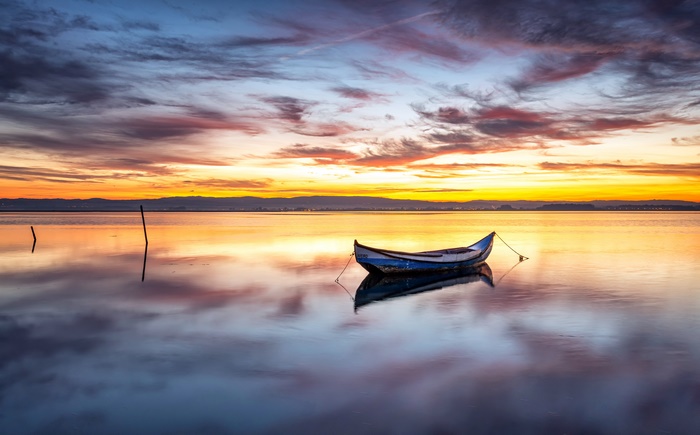 Boat on a lake at sunset