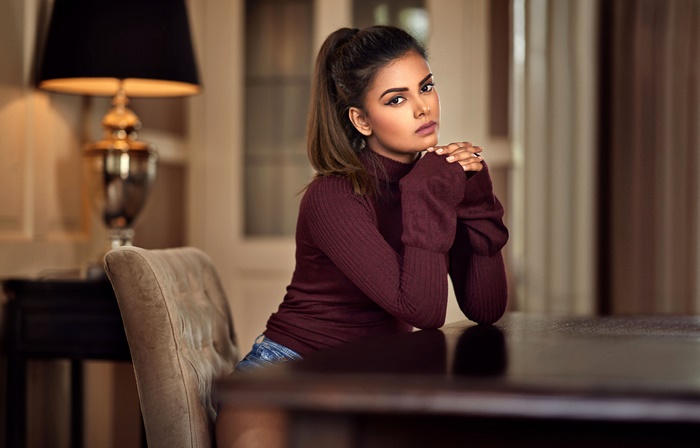 Brunette Woman with Ponytail and Brown Eyes
