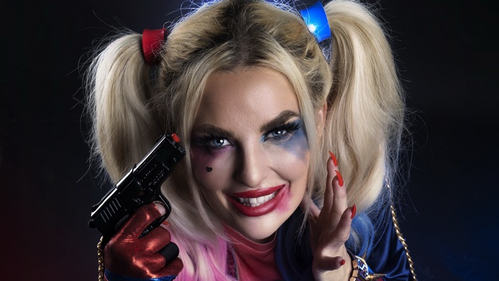 Harley Quinn Cosplayer Holding a Toy Gun