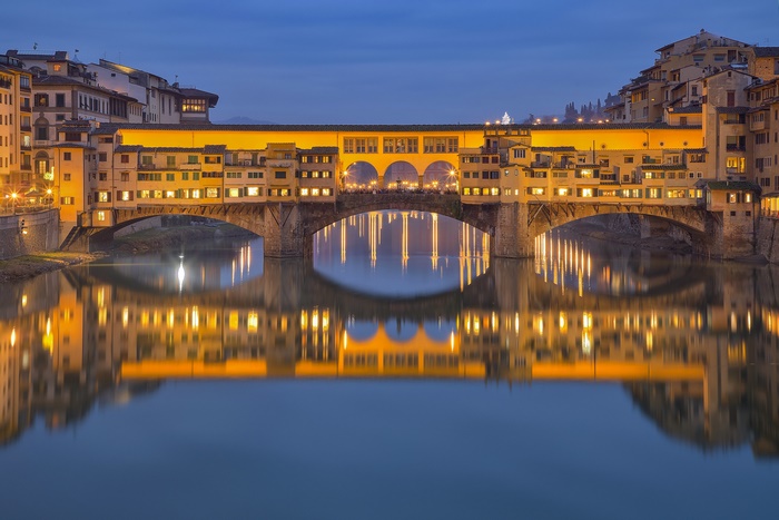 Ponte Vecchio bridge over Arno River at dusk, Florence, Italy