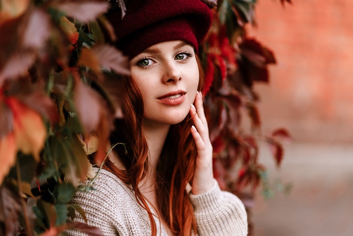 Woman Natalia Andreeva with red hair and beret