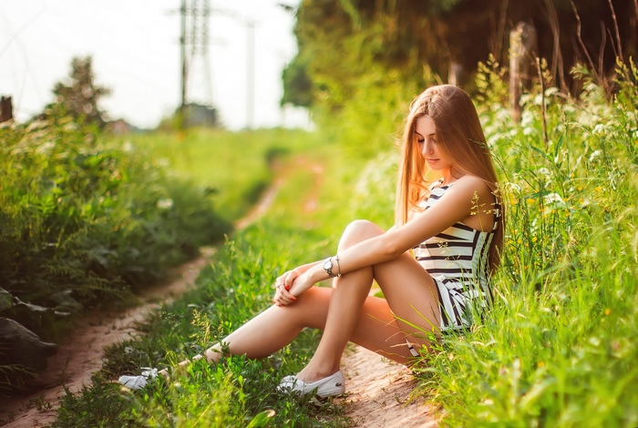 Brunette Woman Sitting on a Country Path