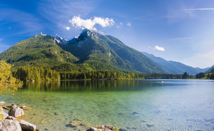 Mountains and lake with clear water and blue sky