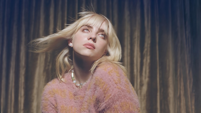 Billie Eilish looking up with blonde hair