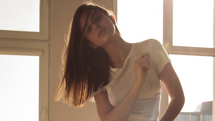 Model posing near a window