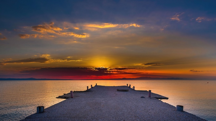 Pier at sunset over the sea