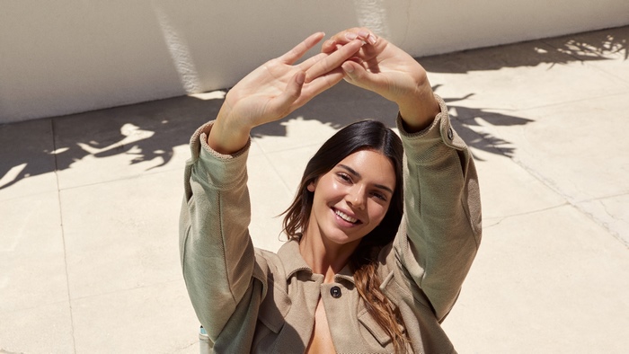 Kendall Jenner posing with hands above head