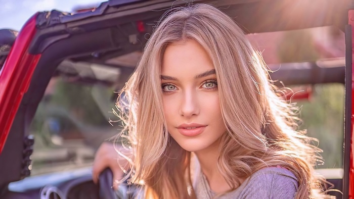 Alexandra Lenarchyk in a red Jeep