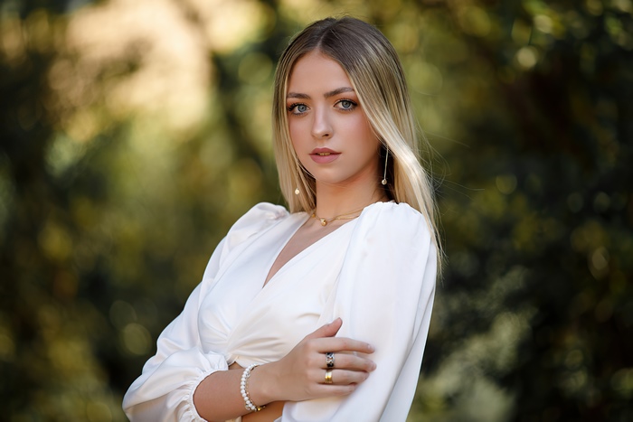 Model in white dress with blonde hair
