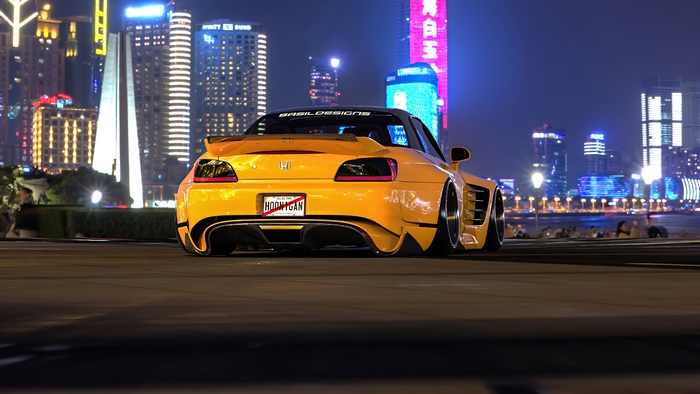 Yellow Honda S2000 with HOONIGAN license plate at night