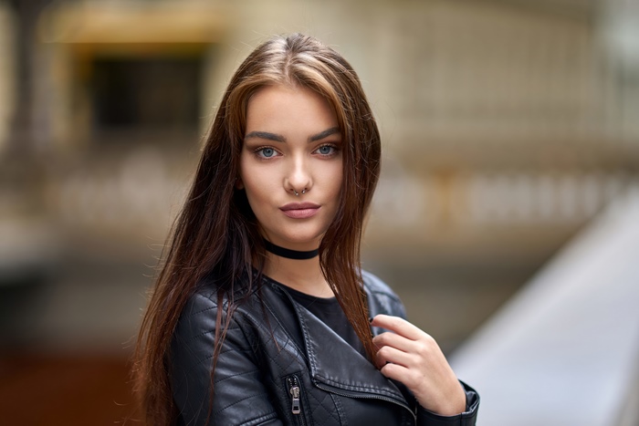 Brunette model with nose ring and choker