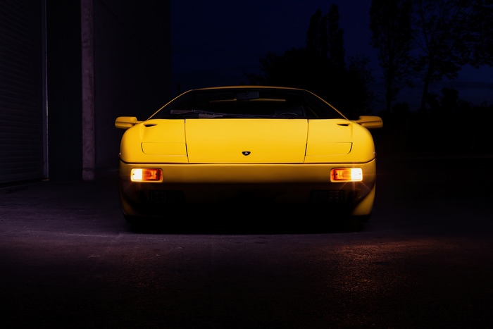 Yellow Lamborghini Diablo parked at night