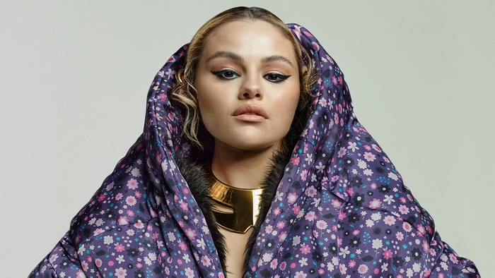 Selena Gomez in a floral puffer jacket and gold necklace