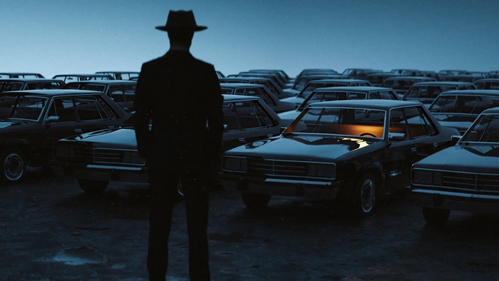 Man in Hat Standing in Parking Lot of Cars