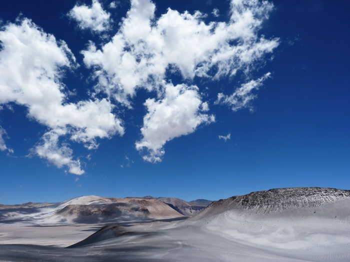 Desert landscape with mountains and clouds