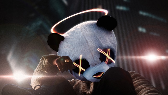 Panda mask artist with glowing eyes and halo