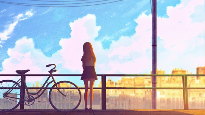 Girl with bicycle overlooking city skyline