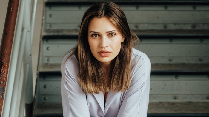 Model sitting on stairs