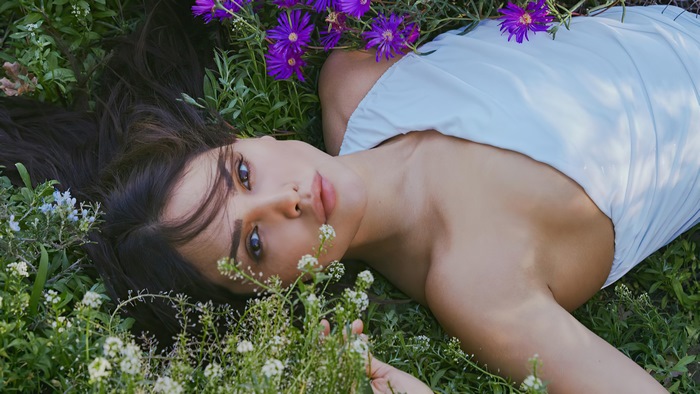 Eiza Gonzalez lying in flowers