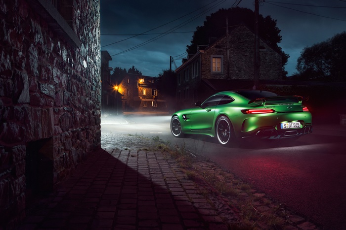 Green Mercedes-AMG GT R on a street at night