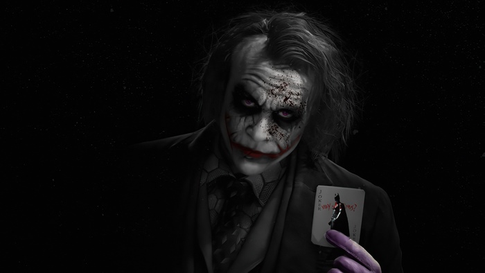 Joker from Batman holding a playing card