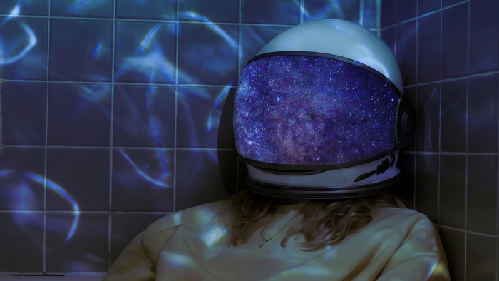 Astronaut helmet with galaxy reflection