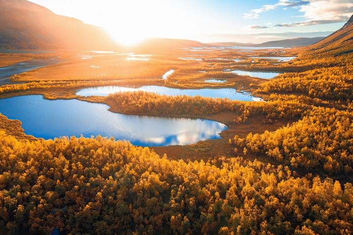 Autumn Sunrise Over Scenic Lakes and Forests