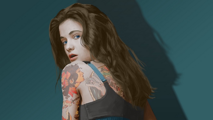 Tattooed woman looking over her shoulder