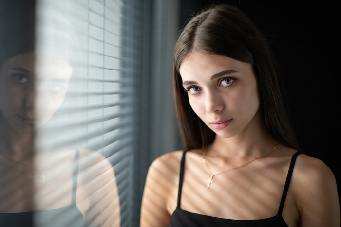 Young woman with a cross necklace
