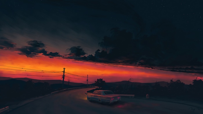 Car driving on a road during sunset