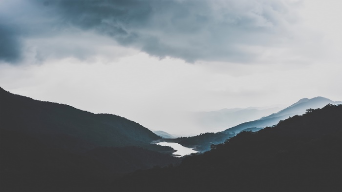 Mountain landscape with lake and clouds