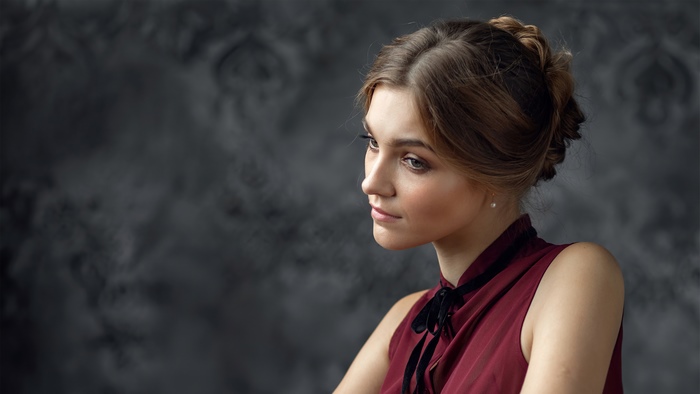 Portrait of a Young Woman in Elegant Dress