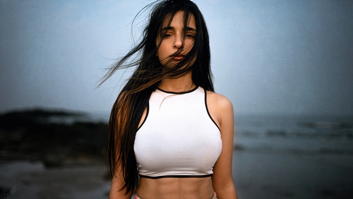 Woman on a beach with windblown hair