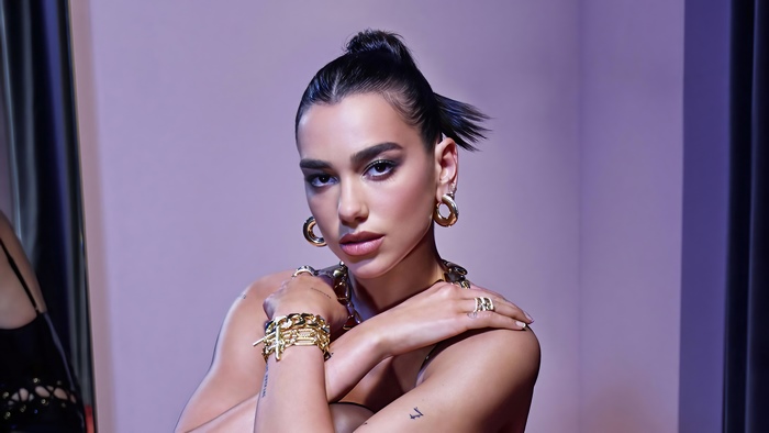 Dua Lipa wearing gold jewelry