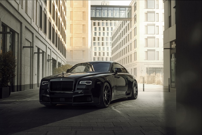 Black Rolls Royce Wraith parked on a street