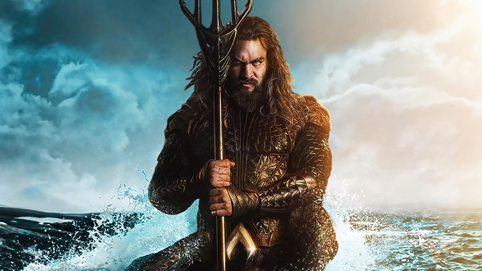 Aquaman holding a trident in the ocean