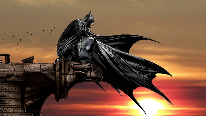 Batman sitting on a gargoyle at sunset