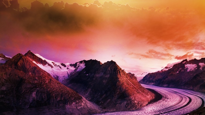 Mountain range with glacier and colorful sky