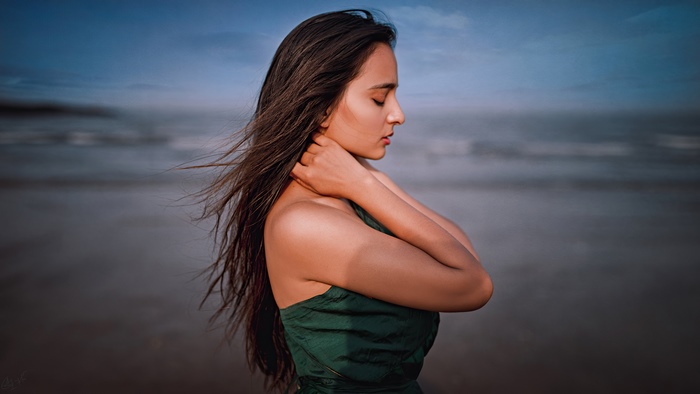 Woman on beach at dusk